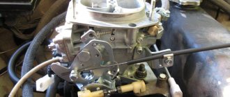 Solex carburetor in the engine compartment of a car