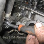 unscrew the coolant supply pipe to the cylinder head on a VAZ 2106